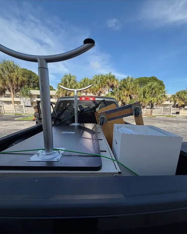 A table and a cabinet loaded in the pickup bed